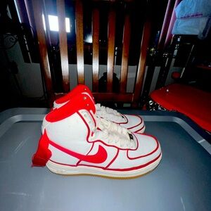 Cream white and red Nikes